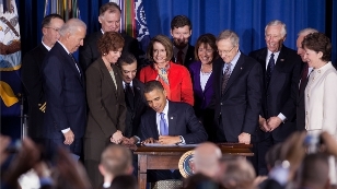 President Obama signs the repeal of the Don't Ask, Don't Tell policy.