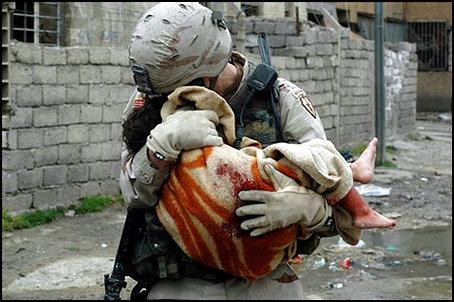 War Baby - An American Soldier holding an injured child