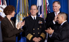 Chairman of the Joint Chiefs of Staff Admiral Mullen as President Obama signs the repeal of the Don't Ask, Don't Tell policy.